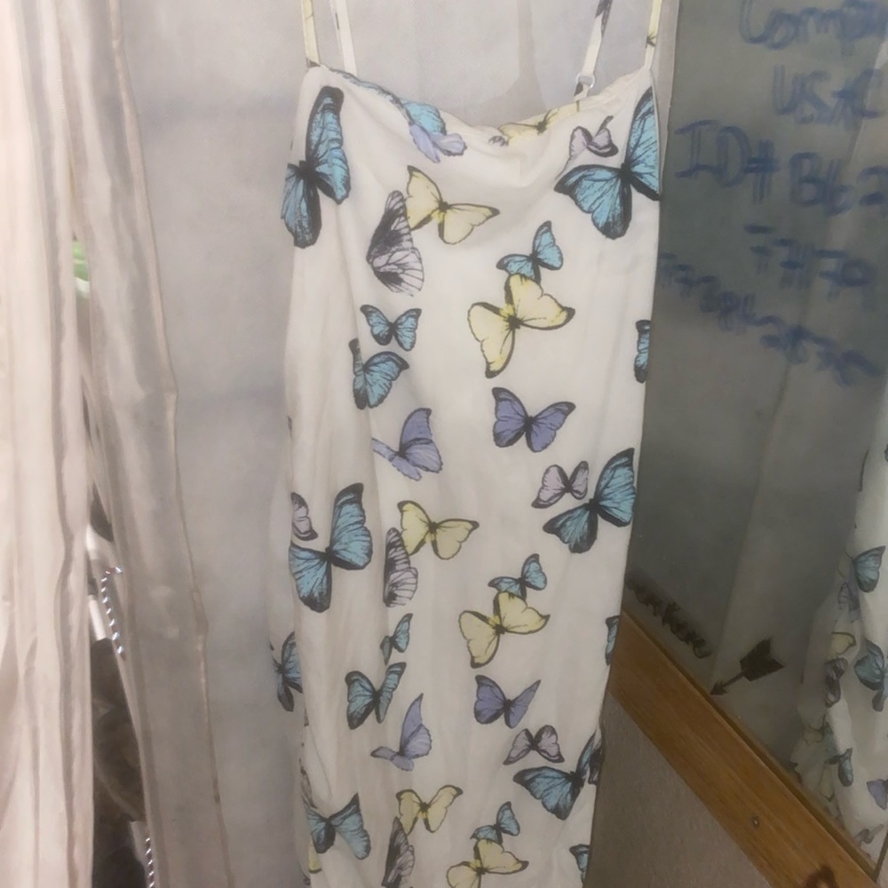 Medium length dress with blue butterflies